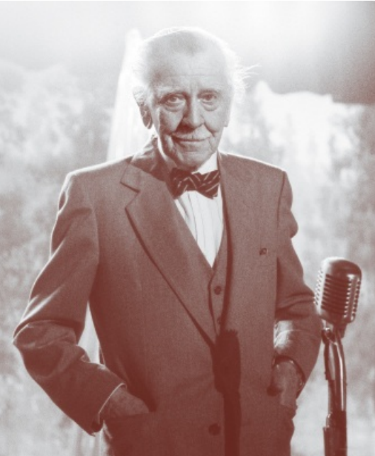 Elderly Colonel Douglas Milford — three-piece suit, bow tie, mustache, beret years; vintage microphone