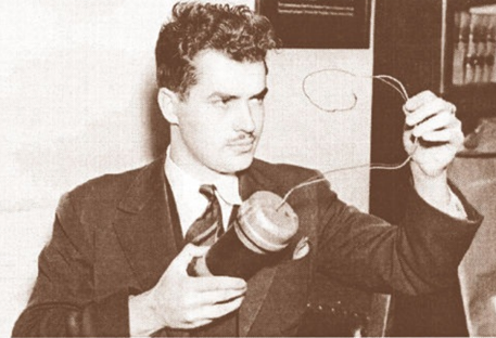 Jack Parsons at JPL holding rocket component, circa 1942