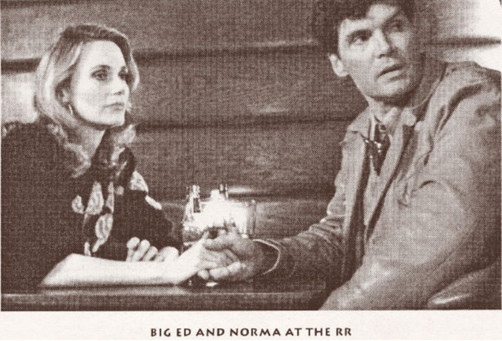 Big Ed and Norma holding hands at the RR diner booth