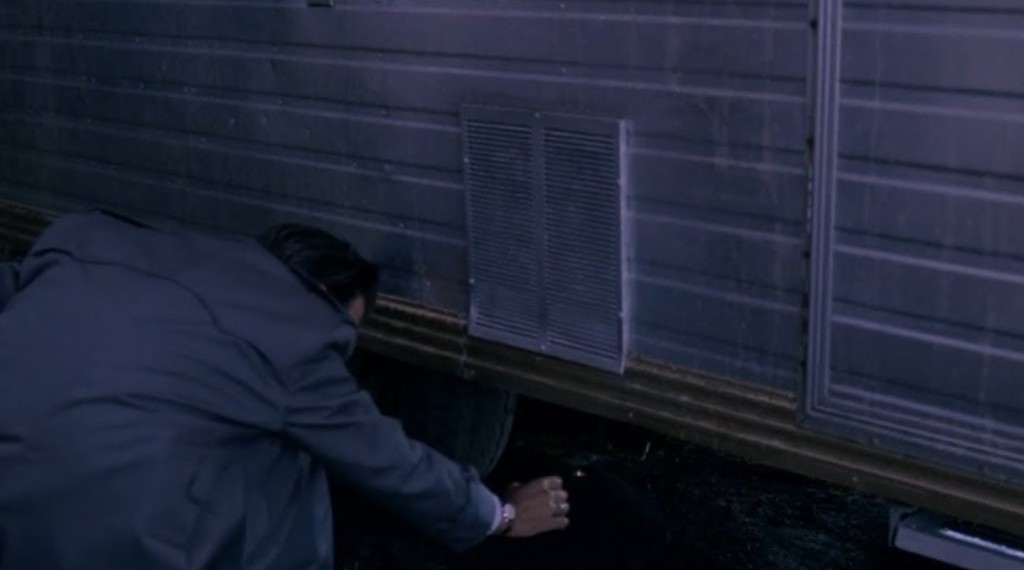 Chet Desmond reaching under the Fat Trout trailer for the ring