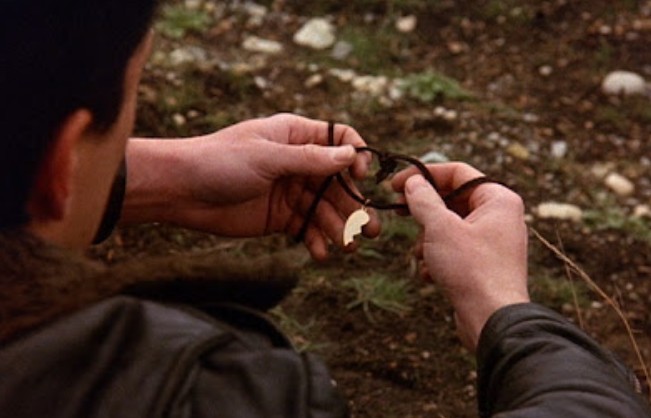 James Hurley holding Laura’s half-heart necklace