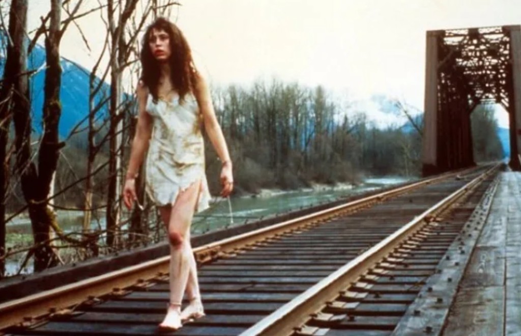 Ronette Pulaski bloodied on the railroad bridge at the state line