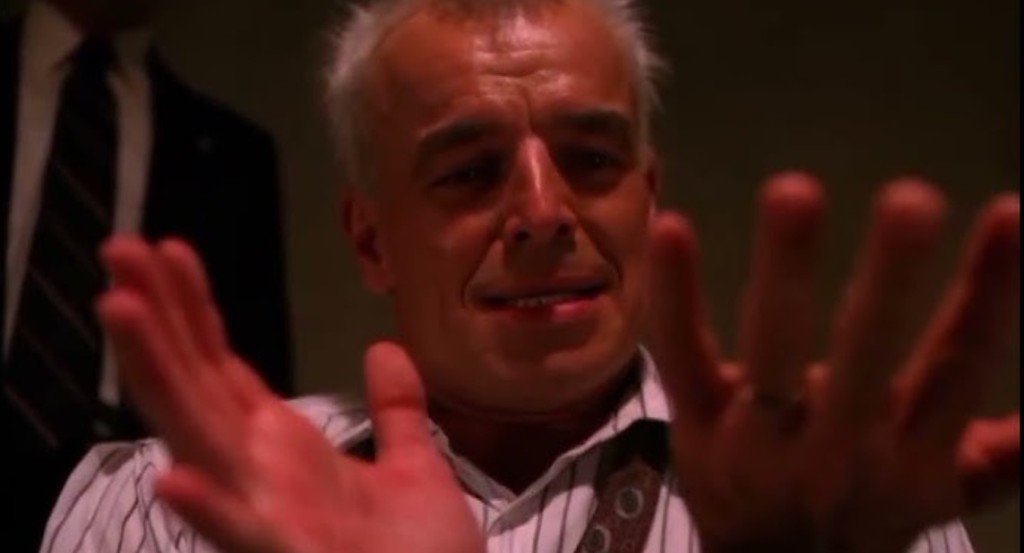 Leland Palmer staring at his hands in distress — custody / confession weather