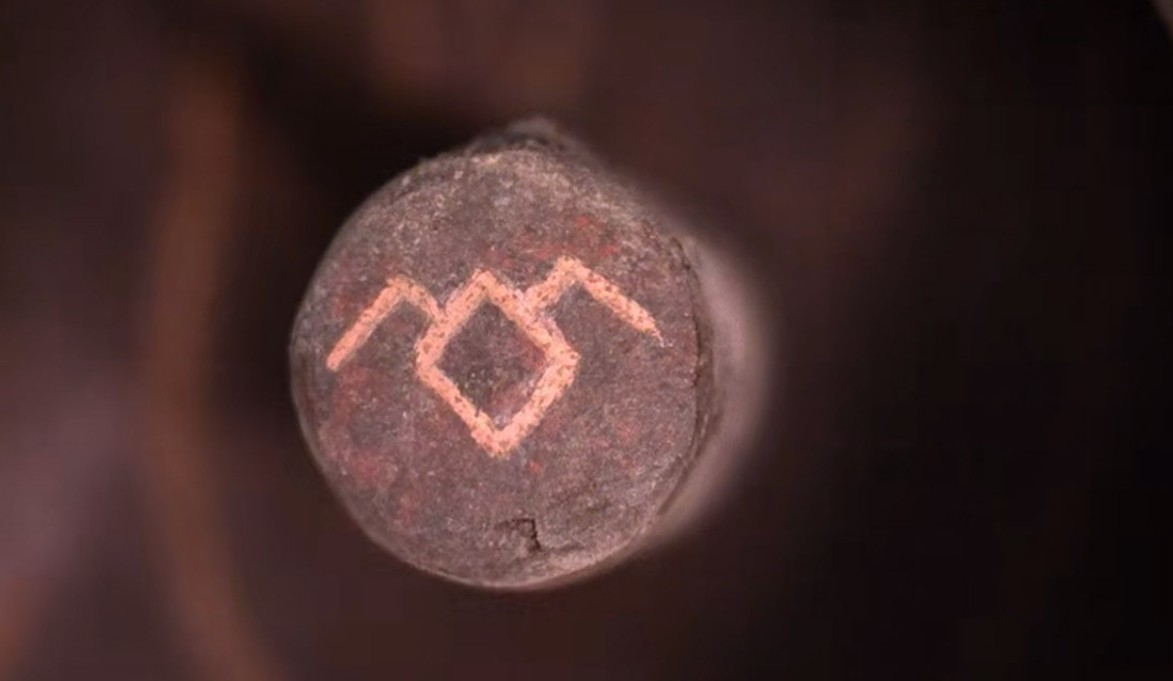 Owl Cave symbol on stone