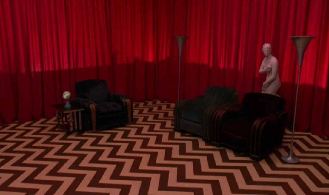 Red Room with chevron floor and curtains