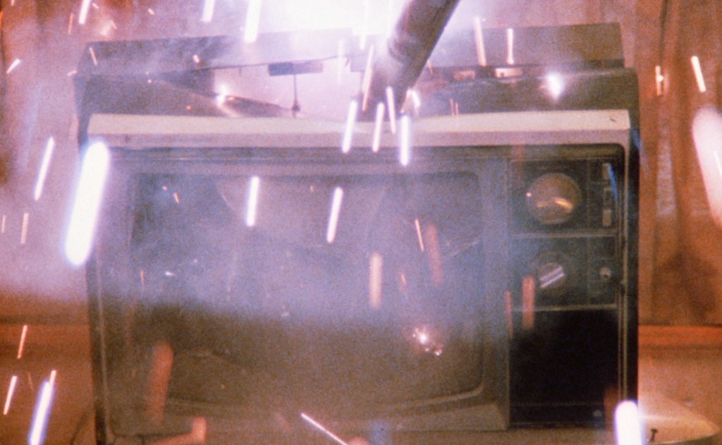 A television set smashed mid-frame - the opening image of Fire Walk with Me