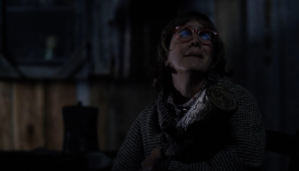 Margaret Lanterman holding her log, listening in the dark