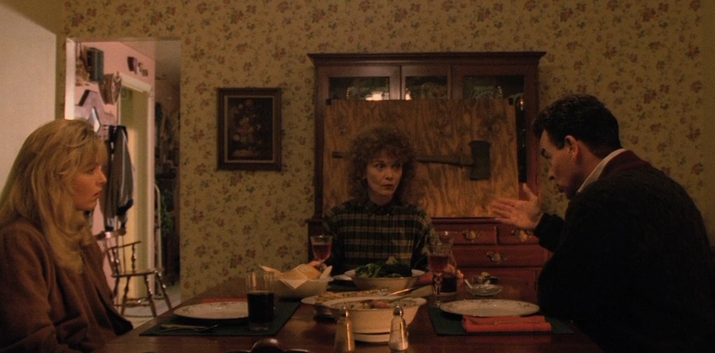 Laura, Sarah and Leland Palmer at the dinner table - axe mounted on plywood behind them
